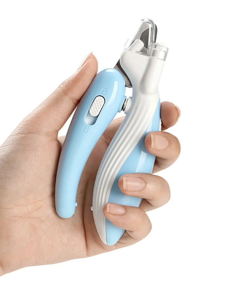 Hand holding the light blue pet nail clipper